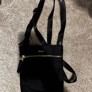 Tumi Black Crossbody Bag with Gold Accents